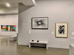 Installion view of a Richard Bell painting with Jeffrey Steele paintings at Newlyn Art Gallery and The Exchange in Penzance