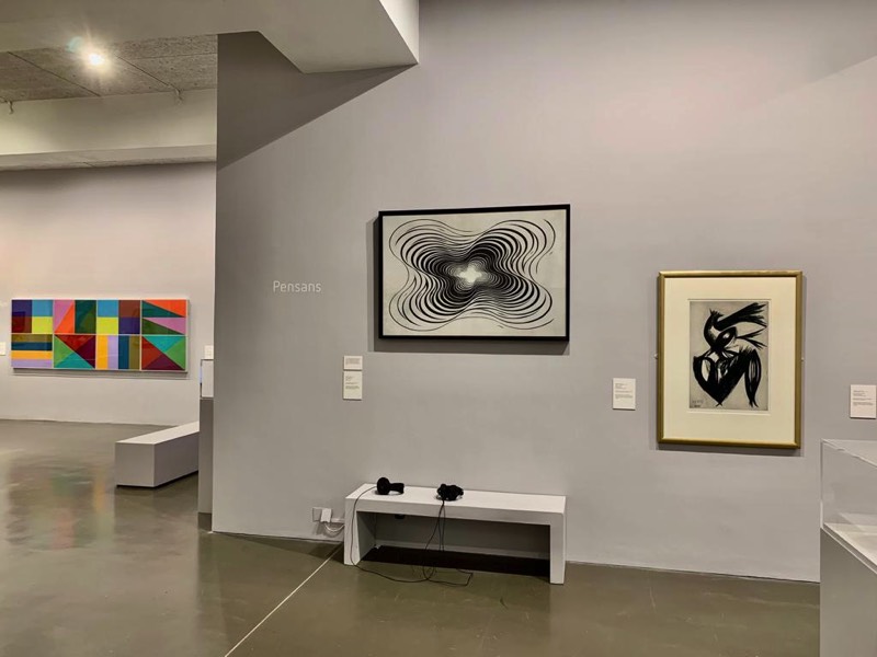 Installion view of a Richard Bell painting with Jeffrey Steele paintings at Newlyn Art Gallery and The Exchange in Penzance